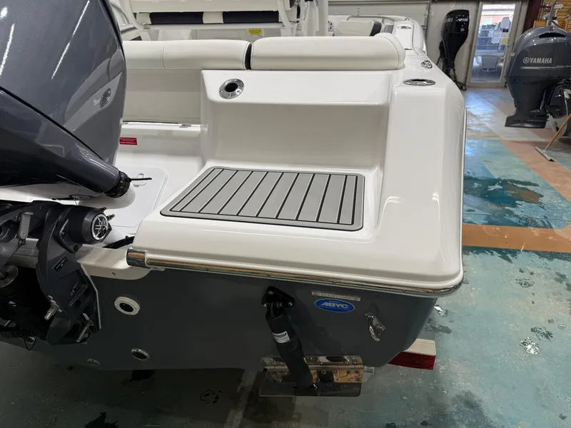 Slide: The Image of 2025 Tidewater 210LXF boat stern with outboard motor in showroom. - 9