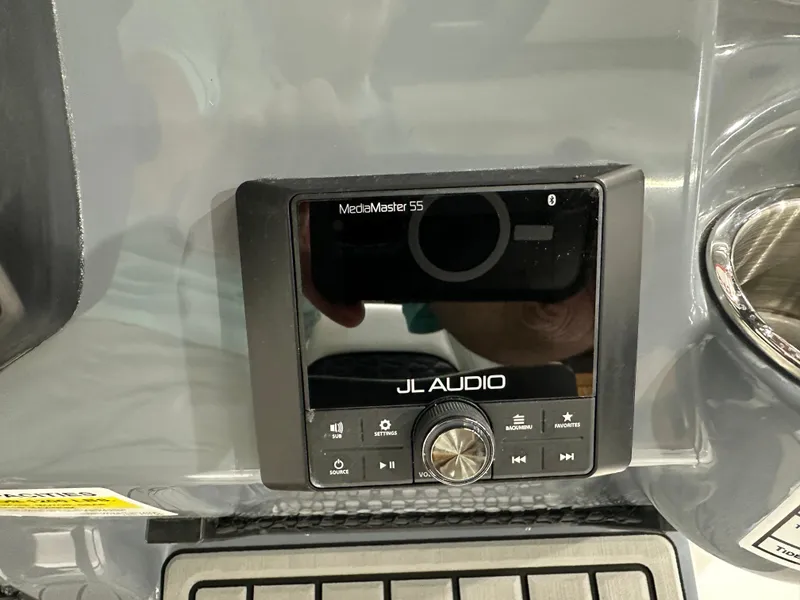 Slide: The Image of JL Audio MediaMaster display on 2025 Tidewater 220LXF boat dashboard. - 17