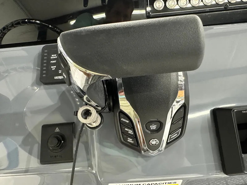 Slide: The Image of Close-up of 2025 Tidewater 220LXF boat throttle control panel. - 18