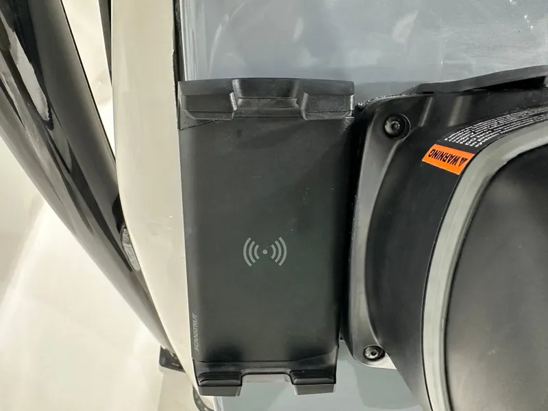 Slide: The Image of Close-up of a 2025 Tidewater 220LXF boat's wireless charging pad. - 22