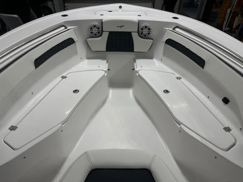 Slide: The Image of 2025 Tidewater 220LXF boat interior with storage compartments and speakers. - 24