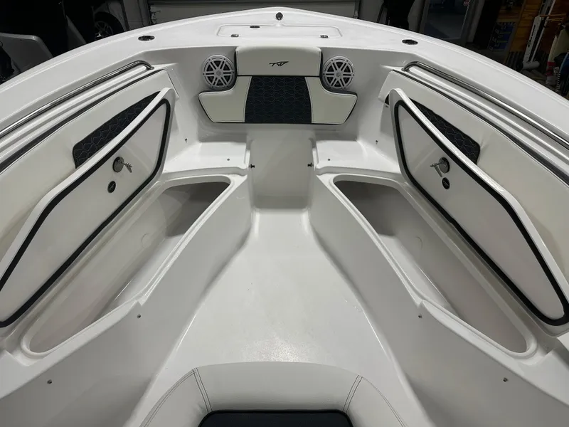 Slide: The Image of 2025 Tidewater 220LXF boat interior with storage compartments and speakers. - 25