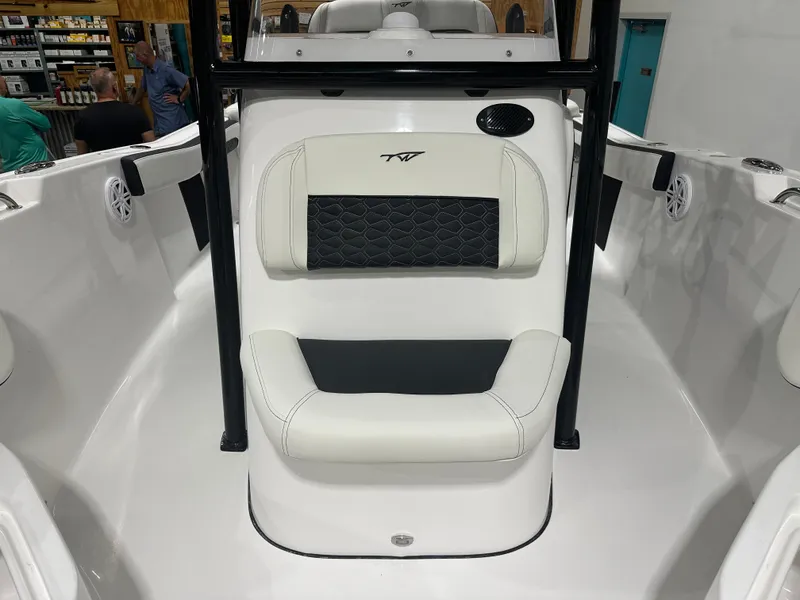 Slide: The Image of 2025 Tidewater 220LXF boat interior with white and black seating. - 28