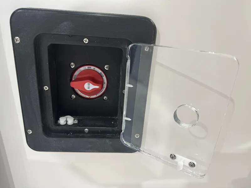 Slide: The Image of Tidewater 220LXF 2025 boat battery switch with protective cover. - 30
