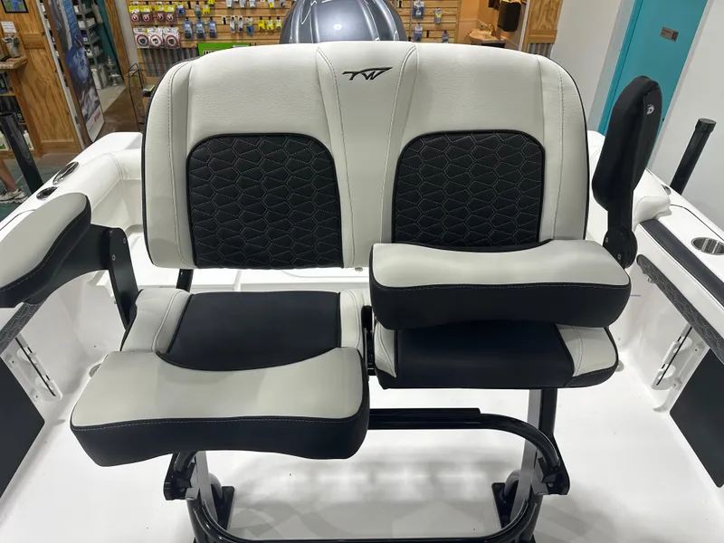 Slide: The Image of 2025 Tidewater 220LXF boat seating with black and white upholstery, showcasing modern design. - 31