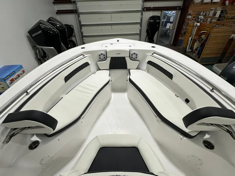 Slide: The Image of 2025 Tidewater 220LXF boat interior with white seating and modern design. - 34