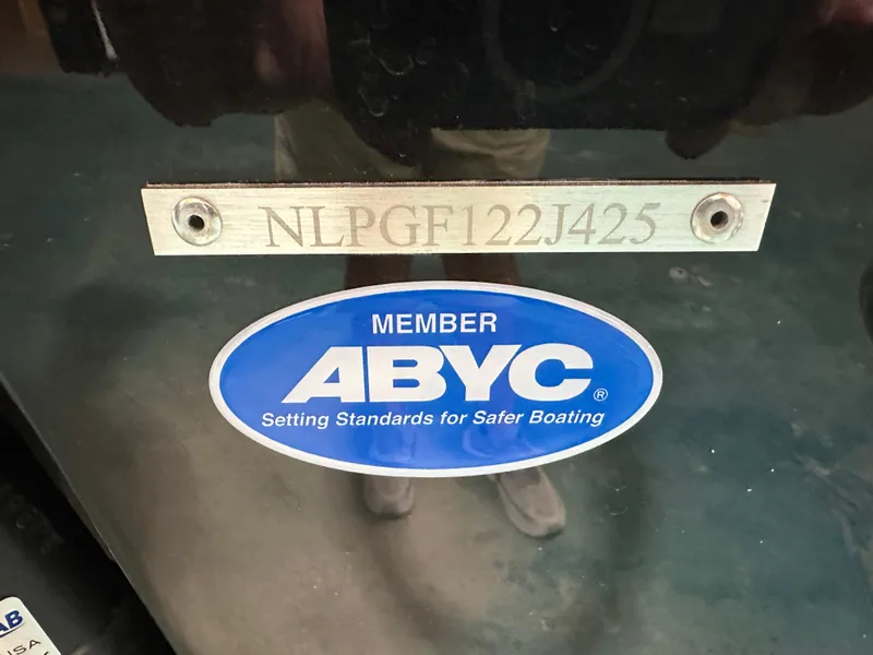Slide: The Image of 2025 Tidewater 220LXF boat with ABYC member sticker and serial number. - 38