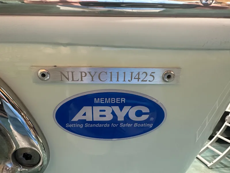 Slide: The Image of Tidewater 320cc 2025 boat with ABYC membership plaque and serial number. - 11