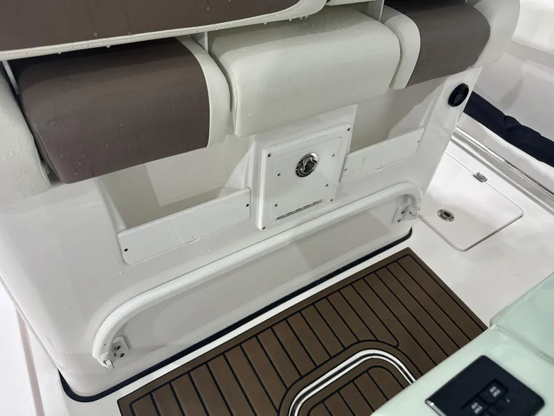 Slide: The Image of 2025 Tidewater 320cc boat interior with cushioned seating and teak flooring. - 23