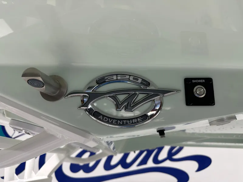 Slide: The Image of Tidewater 320cc 2025 boat emblem with shower button, Adventure series. - 25