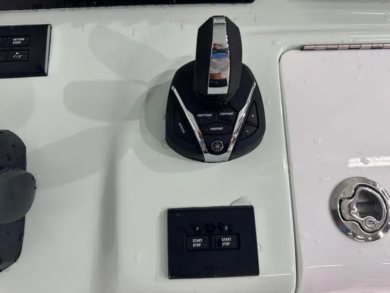 Slide: The Image of 2025 Tidewater 320cc boat control panel with Yamaha joystick and start/stop buttons. - 28