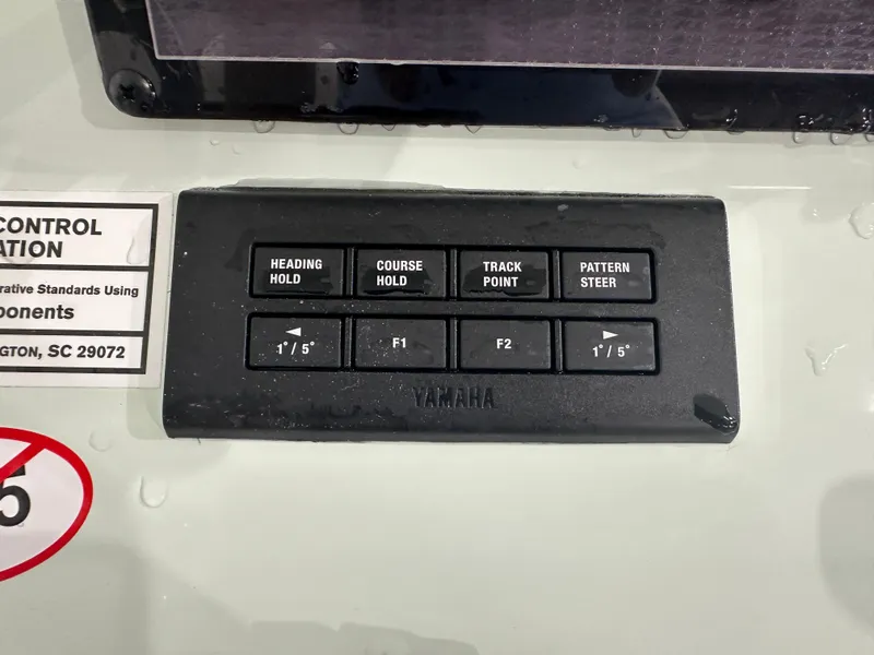 Slide: The Image of Yamaha control panel on 2025 Tidewater 320cc boat, featuring navigation buttons. - 29