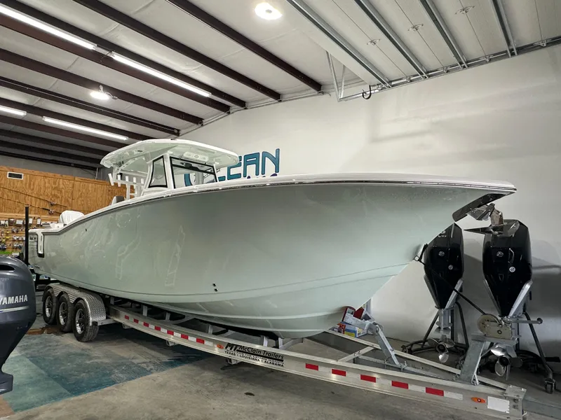 Slide: The Image of 2025 Tidewater 320cc boat on trailer in indoor storage facility. - 3