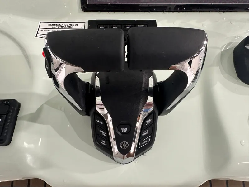 Slide: The Image of Tidewater 320cc 2025 boat throttle controls with emission information label. - 30
