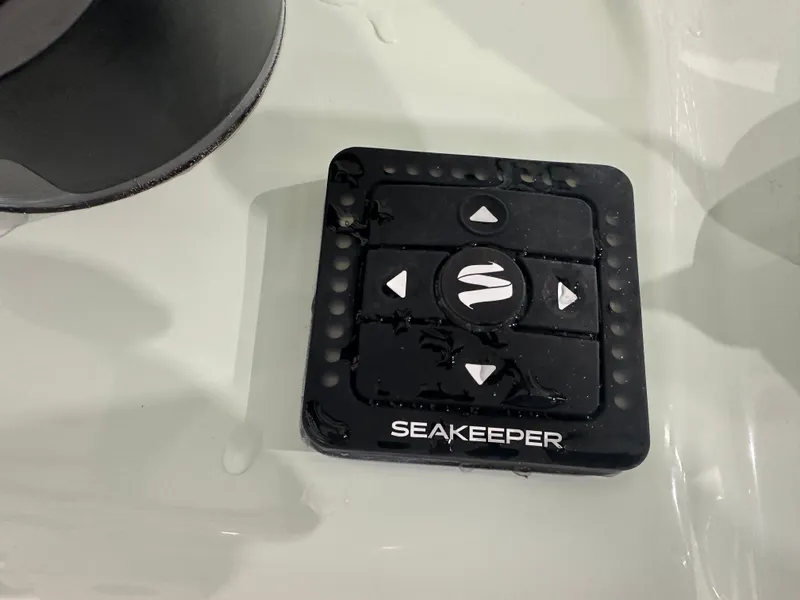 Slide: The Image of Seakeeper control panel on 2025 Tidewater 320cc boat, wet surface. - 31