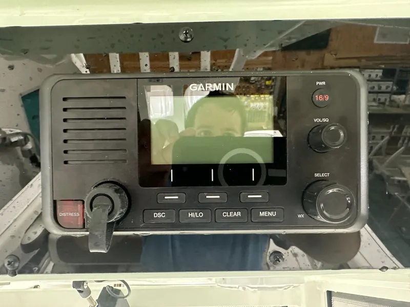 Slide: The Image of Garmin marine radio on 2025 Tidewater 320cc boat dashboard. - 38