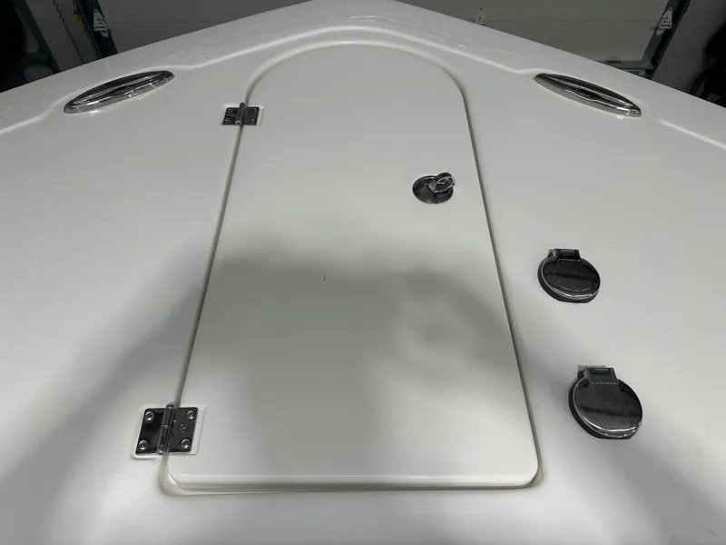 Slide: The Image of 2025 Tidewater 320cc boat deck with hatch and chrome fittings. - 48