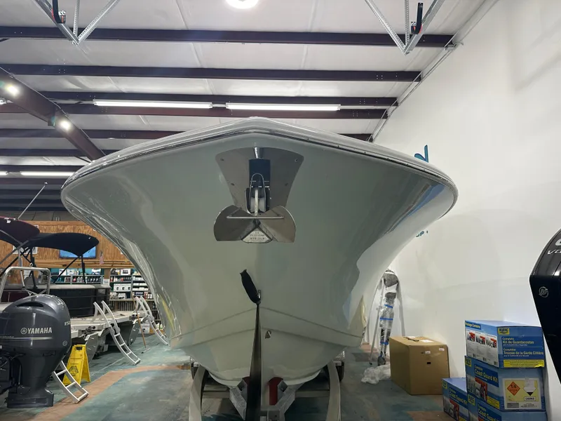 Slide: The Image of 2025 Tidewater 320cc boat in showroom, front view. - 5