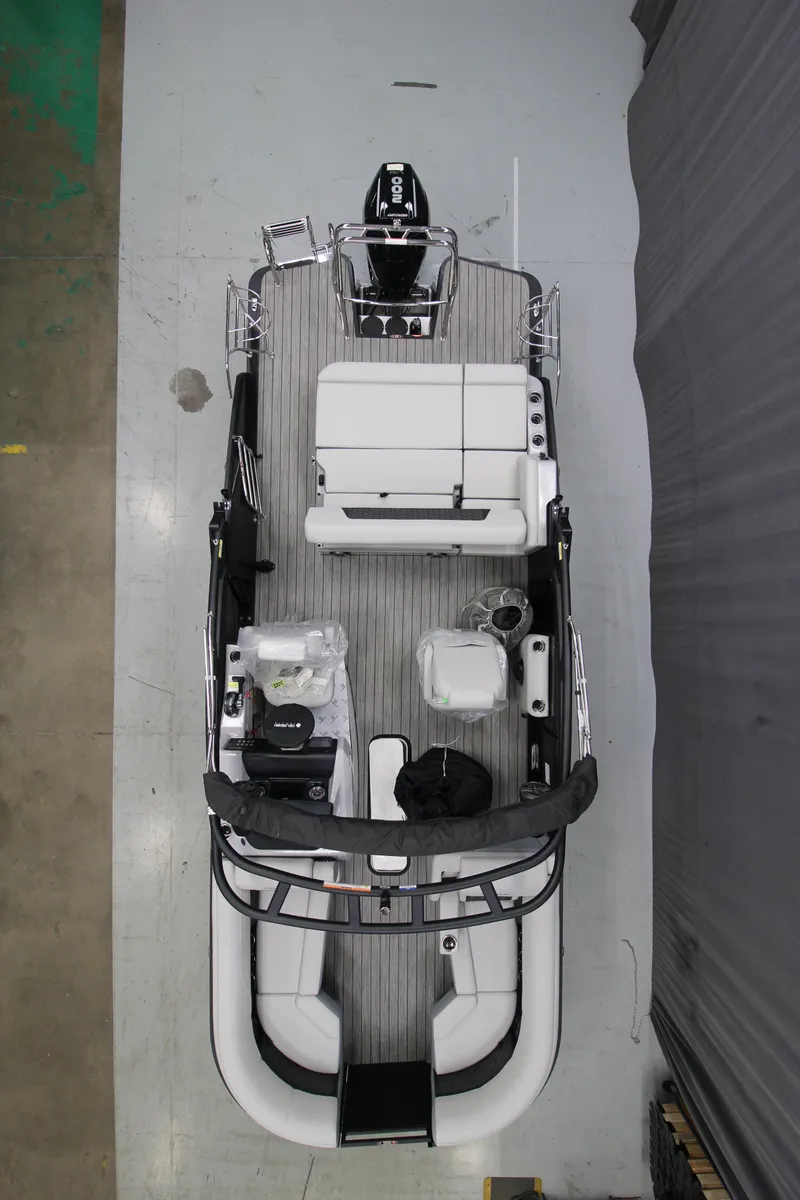 Slide: The Image of 2025 Harris Solstice 230 pontoon boat, aerial view, showcasing spacious seating and modern design. - 1
