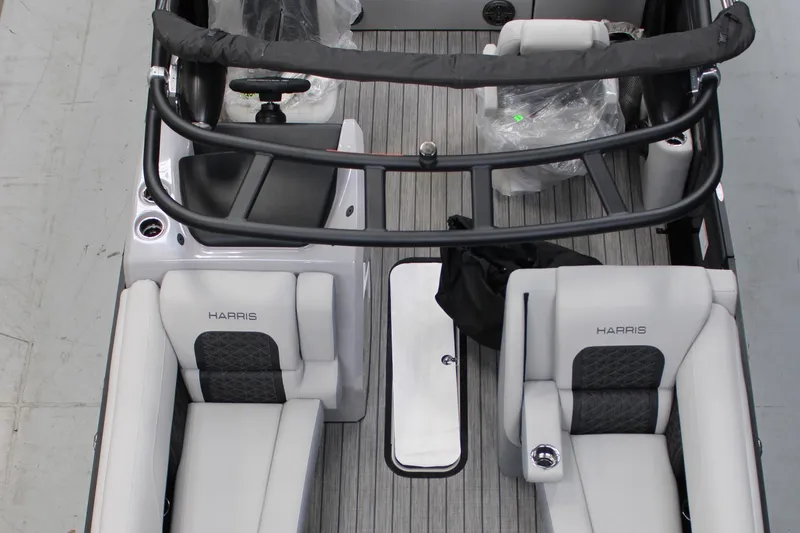 Slide: The Image of 2025 Harris Solstice 230 boat interior with sleek seating and modern design. - 3
