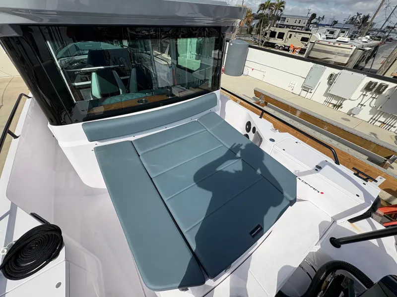 Slide: The Image of 2023 Axopar 28 AFT CABIN boat with spacious deck and modern design. - 9