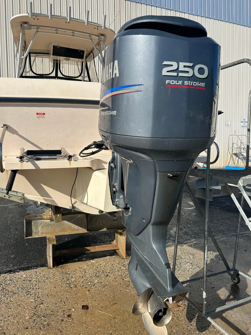 Slide: The Image of 1997 Grady-White 232 Gulfstream boat with Yamaha 250 four-stroke outboard motor. - 10