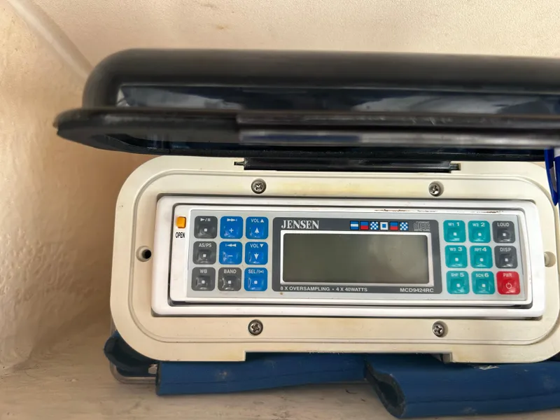 Slide: The Image of Jensen marine radio on 1997 Grady-White 232 Gulfstream boat dashboard. - 14