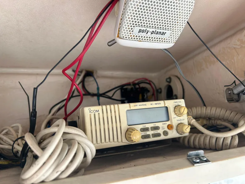 Slide: The Image of 1997 Grady-White 232 Gulfstream boat radio equipment with wiring and speaker. - 15