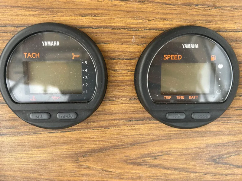 Slide: The Image of Yamaha tachometer and speedometer on 1997 Grady-White 232 Gulfstream boat dashboard. - 16
