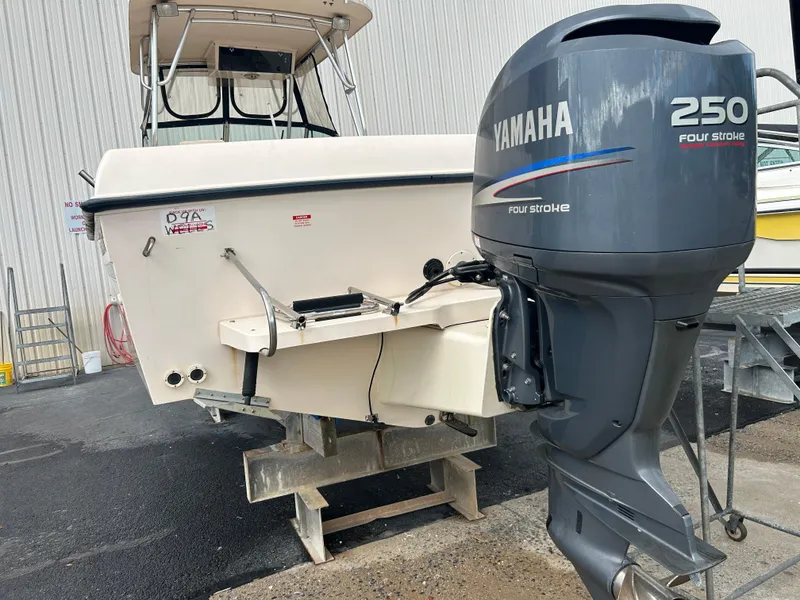 Slide: The Image of 1997 Grady-White 232 Gulfstream boat with Yamaha 250 four-stroke outboard motor. - 3