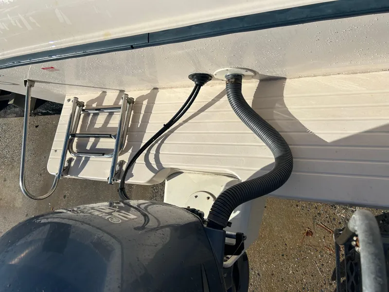 Slide: The Image of 1997 Grady-White 232 Gulfstream boat with motor and ladder detail. - 8