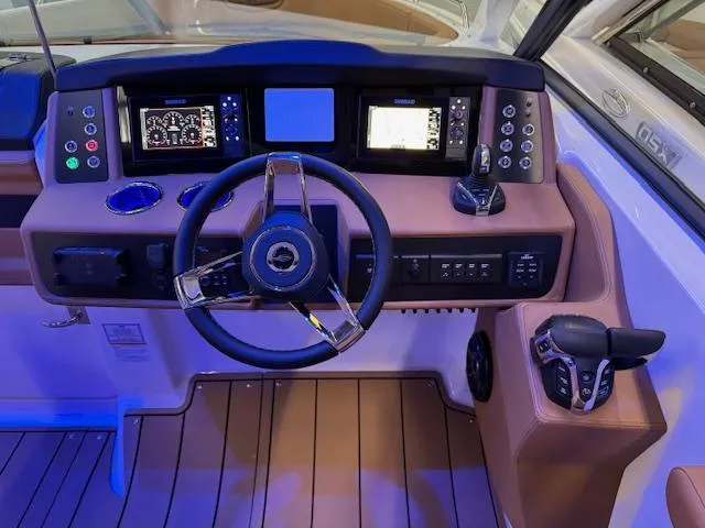 Slide: The Image of 2025 Chaparral 280 OSX helm with modern controls and digital displays. - 13