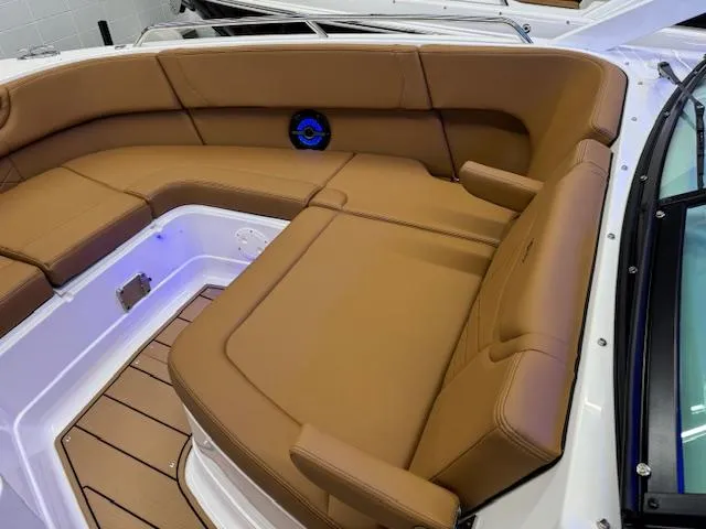 Slide: The Image of 2025 Chaparral 280 OSX boat interior with tan leather seating and modern design. - 3