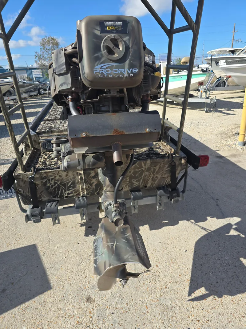 Slide: The Image of 2006 Pro-Drive 1748 boat motor in a marina setting. - 11