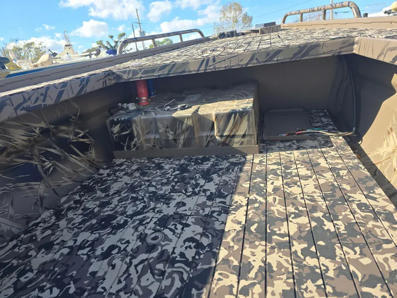 Slide: The Image of Camouflage interior of 2006 Pro-Drive 1748 boat under clear sky. - 6