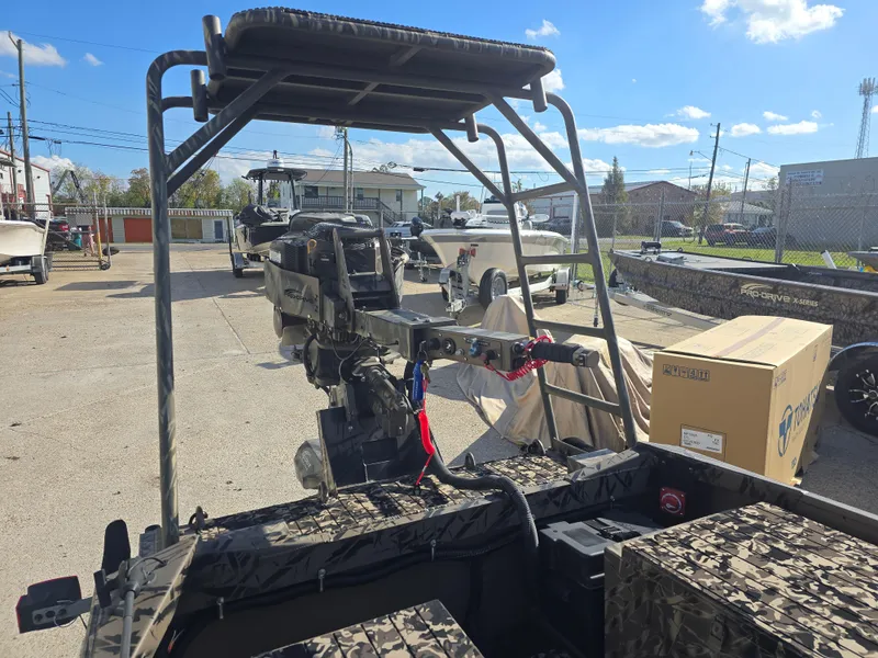 Slide: The Image of 2006 Pro-Drive 1748 boat in a parking lot, featuring a camo design and motor. - 7