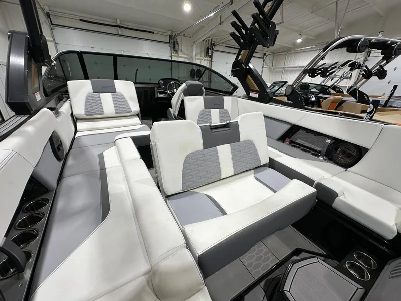 Slide: The Image of 2024 MasterCraft X26 boat interior with luxurious seating and modern design. - 10