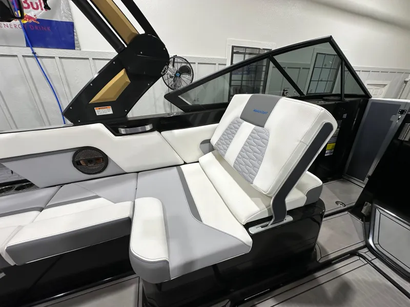 Slide: The Image of 2024 MasterCraft X26 boat interior with luxurious seating and modern design. - 13