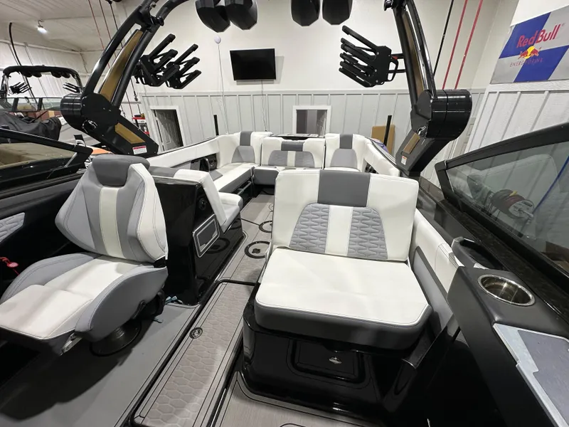Slide: The Image of 2024 MasterCraft X26 boat interior with modern seating and sleek design. - 14