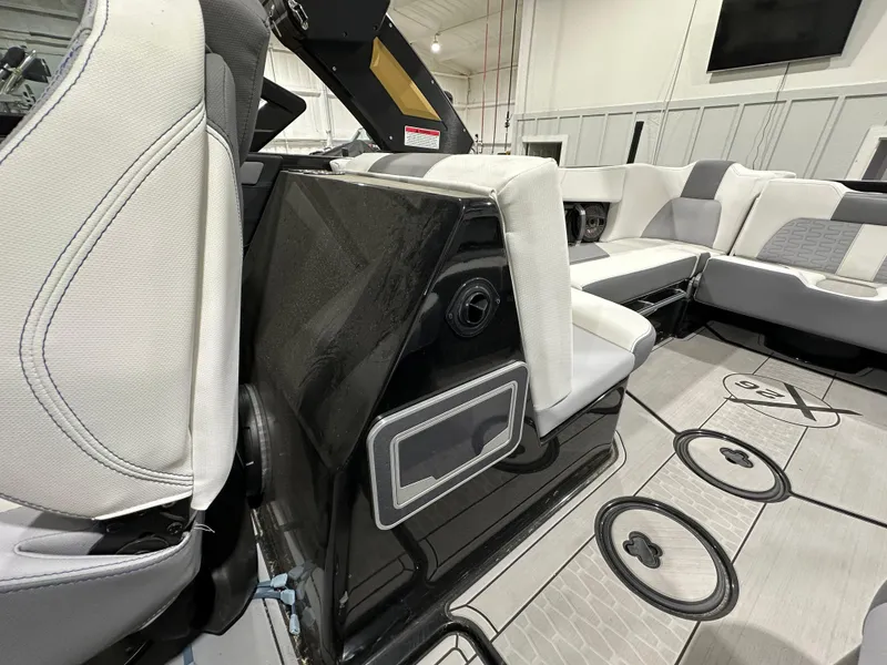 Slide: The Image of 2024 MasterCraft X26 boat interior with modern seating and sleek design. - 15