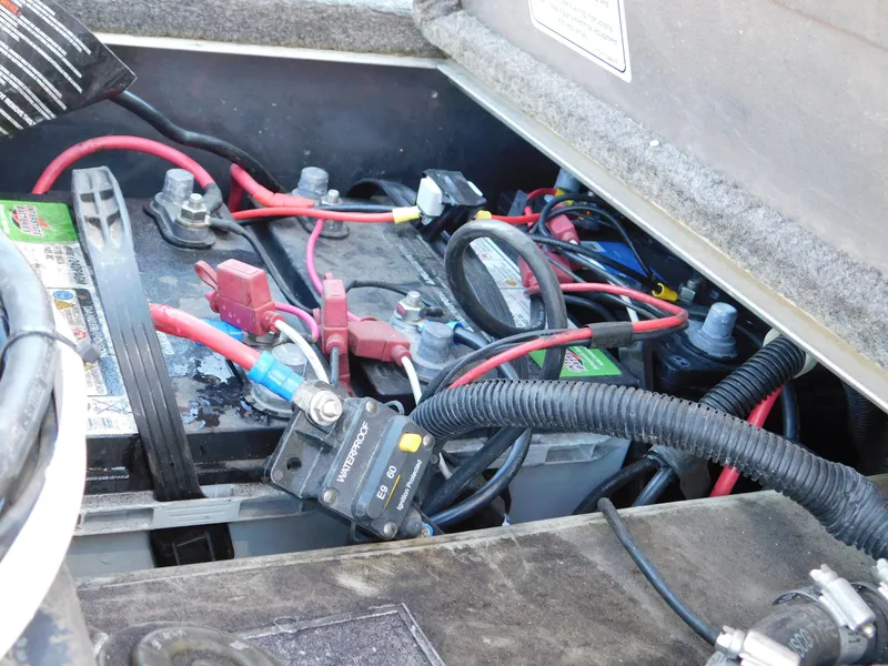 Slide: The Image of Battery compartment of a 2015 Tracker Pro Team 190 TX boat with visible wiring. - 22