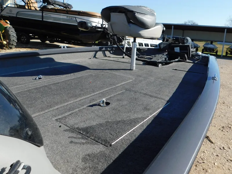 Slide: The Image of 2015 Tracker Pro Team 190 TX boat deck with seating and storage compartments. - 27