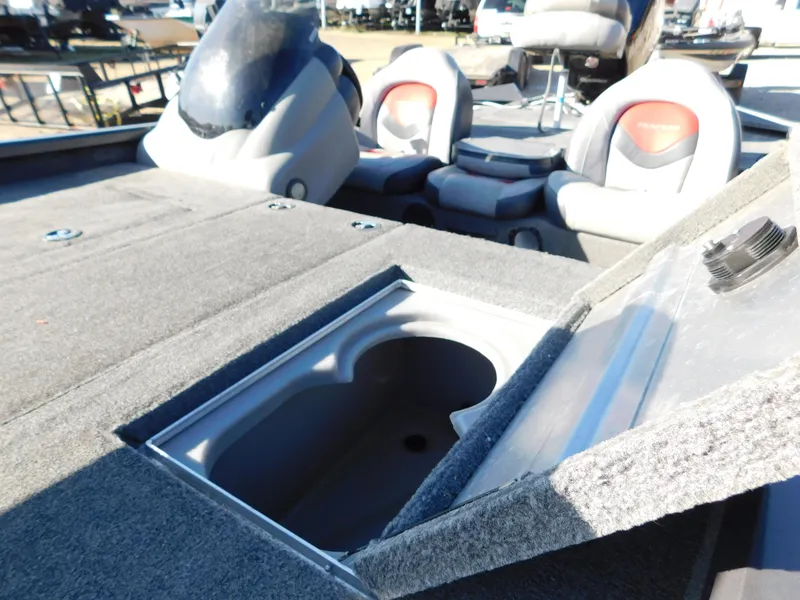 Slide: The Image of 2015 Tracker Pro Team 190 TX boat interior with open storage compartment. - 35