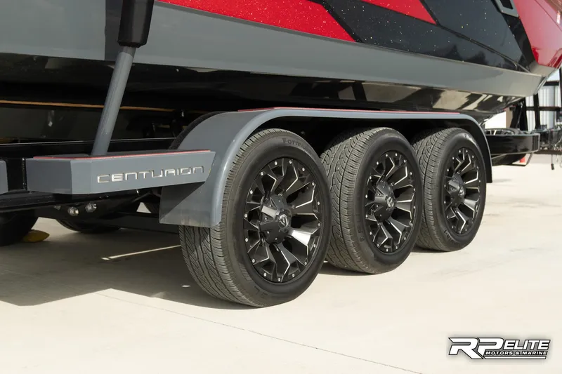 Slide: The Image of 2024 Centurion Ri245 boat trailer with triple axle and sleek black wheels. - 17