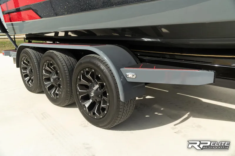 Slide: The Image of 2024 Centurion Ri245 boat trailer with triple axle and black alloy wheels. - 22