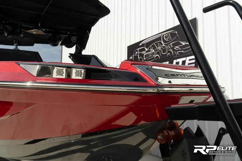 Slide: The Image of 2024 Centurion Ri245 boat, red exterior, showcased at RP Elite Motors & Marine. - 26