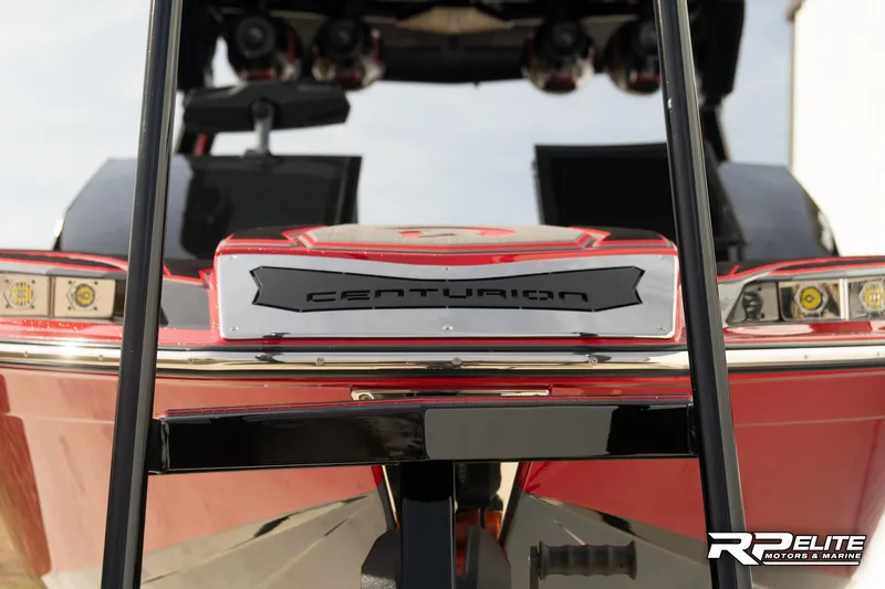 Slide: The Image of 2024 Centurion Ri245 boat rear view with sleek design and modern features. - 27