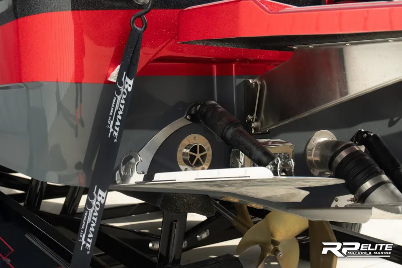 Slide: The Image of 2024 Centurion Ri245 boat stern with propeller and trim tab details. - 34