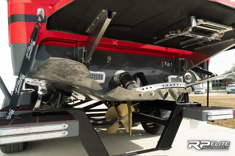 Slide: The Image of 2024 Centurion Ri245 boat underside with propeller and wakeboard features. - 35