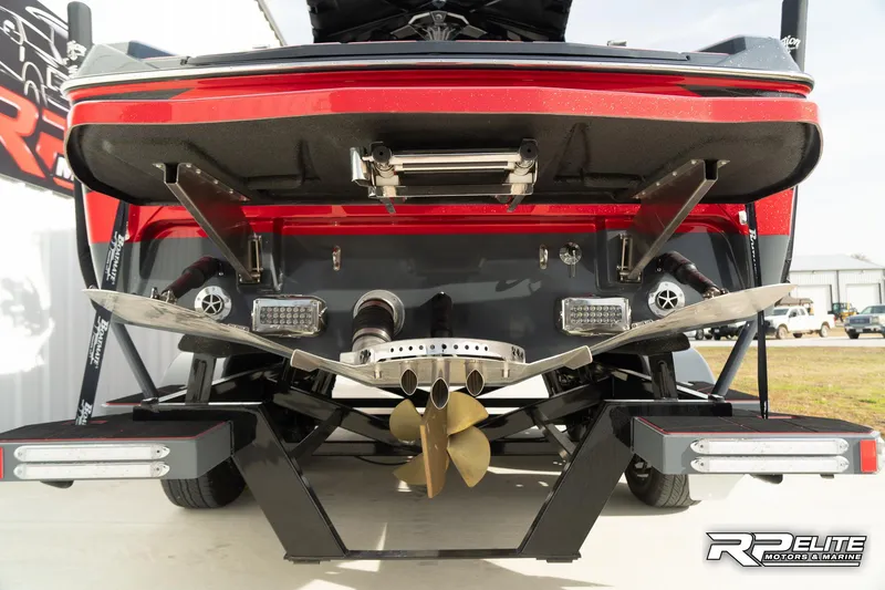 Slide: The Image of 2024 Centurion Ri245 boat rear view with propeller and exhaust system. - 38